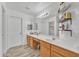 Bright bathroom with double sinks, large mirror, and ample counter space at 13638 W Desert Flower Dr, Goodyear, AZ 85395