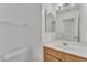 Simple bathroom with wood vanity and single sink at 13638 W Desert Flower Dr, Goodyear, AZ 85395