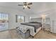 Spacious bedroom with plush bed and access to patio at 13638 W Desert Flower Dr, Goodyear, AZ 85395