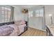 Bright bedroom with a twin bed and natural light at 13638 W Desert Flower Dr, Goodyear, AZ 85395