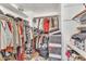 Large walk-in closet with ample shelving and hanging space at 13638 W Desert Flower Dr, Goodyear, AZ 85395