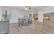 Bright dining area with fireplace and kitchen views at 13638 W Desert Flower Dr, Goodyear, AZ 85395