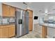 Kitchen with stainless steel refrigerator and granite counters at 13638 W Desert Flower Dr, Goodyear, AZ 85395