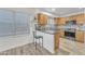 Modern kitchen with wood cabinets and granite counters at 13638 W Desert Flower Dr, Goodyear, AZ 85395