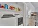 Laundry room with washer, dryer, and shelving at 13638 W Desert Flower Dr, Goodyear, AZ 85395