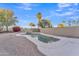 Private backyard pool with a rock waterfall feature at 13638 W Desert Flower Dr, Goodyear, AZ 85395