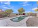 Relaxing kidney-shaped pool with waterfall feature at 13638 W Desert Flower Dr, Goodyear, AZ 85395