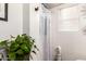 Small bathroom with shower and white curtains at 13829 W Rovey Ave, Litchfield Park, AZ 85340