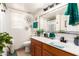 Bathroom with single vanity and shower/tub combo at 13829 W Rovey Ave, Litchfield Park, AZ 85340