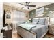 Bedroom with a light-grey colored bed frame and beach-themed decor at 13829 W Rovey Ave, Litchfield Park, AZ 85340