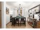 Small dining area with a table and four chairs at 13829 W Rovey Ave, Litchfield Park, AZ 85340