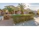 Two-story house with lush landscaping and a two-car garage at 13829 W Rovey Ave, Litchfield Park, AZ 85340