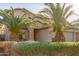 Two-story house with palm trees and well-maintained landscaping at 13829 W Rovey Ave, Litchfield Park, AZ 85340
