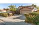 Two-story house with solar panels and a two-car garage at 13829 W Rovey Ave, Litchfield Park, AZ 85340