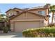 Two-story house with solar panels, and a two-car garage at 13829 W Rovey Ave, Litchfield Park, AZ 85340