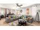Bright living room featuring comfortable seating and a dining area at 13829 W Rovey Ave, Litchfield Park, AZ 85340