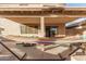 Relaxing patio with covered seating and hammock at 13829 W Rovey Ave, Litchfield Park, AZ 85340