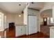 Kitchen with granite counters, white cabinets and breakfast bar at 1449 W Islandia Dr, Gilbert, AZ 85233