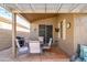 Cozy covered patio includes outdoor dining, BBQ and offers a comfortable space for entertaining at 17202 N Javelina Dr, Surprise, AZ 85374