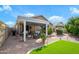 Charming backyard with a cozy patio area, well-maintained landscaping, and a relaxing outdoor space at 17202 N Javelina Dr, Surprise, AZ 85374