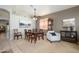 Cozy dining room featuring a traditional table set, grandfather clock and elegant decor at 17202 N Javelina Dr, Surprise, AZ 85374