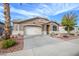 Beautiful single-story home with desert landscaping, a spacious driveway, and a charming, well-maintained exterior at 17202 N Javelina Dr, Surprise, AZ 85374