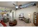 Inviting living room featuring comfortable seating, ceiling fan, and decorative wall accents at 17202 N Javelina Dr, Surprise, AZ 85374