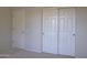 Bedroom with double door closet and carpet flooring at 17733 N Escalante Ln, Surprise, AZ 85374