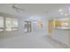 Combined dining and living area with chandelier and patio access at 17733 N Escalante Ln, Surprise, AZ 85374