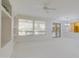 Bright living room features built-in shelving and sliding glass doors to a patio at 17733 N Escalante Ln, Surprise, AZ 85374