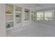 Living room showcasing built-in shelving units for storage and display at 17733 N Escalante Ln, Surprise, AZ 85374