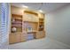 Home office with built-in desk and shelving unit at 17733 N Escalante Ln, Surprise, AZ 85374