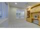 Home office with built-in wooden cabinetry and plenty of natural light at 17733 N Escalante Ln, Surprise, AZ 85374