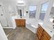 Bathroom features double sinks, soaking tub, and shower at 18164 W Smokey Dr, Surprise, AZ 85388