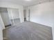 Spacious bedroom with mirrored closet doors and carpet at 18164 W Smokey Dr, Surprise, AZ 85388
