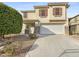 Two-story house with a two-car garage and landscaped front yard at 18164 W Smokey Dr, Surprise, AZ 85388