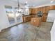 Kitchen with island, granite counters, and patio access at 18164 W Smokey Dr, Surprise, AZ 85388