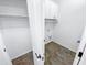 Bright laundry room with white cabinets and tile floor at 18164 W Smokey Dr, Surprise, AZ 85388