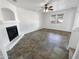 Spacious living room with tile floors and a fireplace at 18164 W Smokey Dr, Surprise, AZ 85388