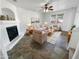 Bright living room featuring a fireplace and tile flooring at 18164 W Smokey Dr, Surprise, AZ 85388