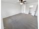 Spacious main bedroom with carpeted floor and ceiling fan at 18164 W Smokey Dr, Surprise, AZ 85388