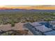 Aerial view of homes and desert landscape with mountain views at 18324 E Spring Valley Ct, Rio Verde, AZ 85263