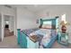 Guest bedroom with teal wood bed frame and ensuite bathroom at 18324 E Spring Valley Ct, Rio Verde, AZ 85263