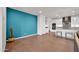 Bright dining area with teal accent wall and kitchen view at 18324 E Spring Valley Ct, Rio Verde, AZ 85263