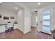 Bright entryway with built-in workspace and view to living area at 18324 E Spring Valley Ct, Rio Verde, AZ 85263
