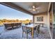Covered patio with seating area and mountain views at 18324 E Spring Valley Ct, Rio Verde, AZ 85263