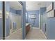 Clean bathroom with dual sinks, shower, and tiled floors at 19043 N Aztec Point Dr, Surprise, AZ 85387