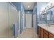 Bathroom with shower, vanity, and tiled floors at 19043 N Aztec Point Dr, Surprise, AZ 85387