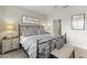 Spacious bedroom with metal frame bed, nightstands, and artwork at 19043 N Aztec Point Dr, Surprise, AZ 85387