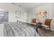 Bright bedroom with a comfortable bed and sitting area at 19043 N Aztec Point Dr, Surprise, AZ 85387